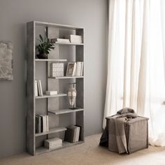 a book shelf in the corner of a room