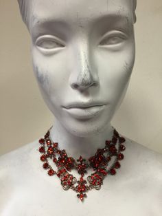 Indian red Swarovski crystals on an antique copper finish. Chain is adjustable. Vintage Red Choker For Party, Red Metal Choker For Party, Red Rhinestone Evening Necklaces, Red Rhinestone Necklaces For Evening, Red Rhinestone Evening Necklace, Evening Red Rhinestone Necklace, Vintage Red Metal Choker, Red Jeweled Rhinestone Necklace For Party, Red Choker Necklace For Formal Occasions