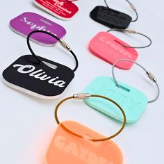 Crafted for adventure travelers, students, and music enthusiasts, our custom-designed tags are made from approximately 1/8" acrylic, ensuring a minimalist yet durable design. Ideal for light-duty needs such as school backpacks, social events, and travel, these name tags offer both durability and elegance. Customization Options (Only One(1) side is engraved: - Name: Choose to engrave your full name, first name, or last name in one of 5 font styles: - Address: Personalize with your full address or the address of the intended recipient. - Phone Number: Add your full phone number or the number of someone who will receive your luggage. - Email Address (optional) Features: - Dimensions: 2" x 2" rounded corner square - Material: Acrylic  - Includes a silver 6" stainless steel cable, other colors, Backpack Name Tags, Kids Name Labels, Label Name, Name Keychain, Name Label, Personalized Luggage, Stainless Steel Cable, Name Labels, Id Tags