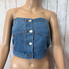 New Super Cute Denim Bustier Good Condition New Open With Buttons On The Front And On The Back It Has Stretched Pleats Size Medium Made In China Dark Wash Cropped Top With Button Closure, Fitted Strapless Top With Button Closure, Trendy Fitted Button-up Denim Top, Fitted Blue Denim Vest With Snap Buttons, Blue Fitted Denim Vest With Snap Buttons, Cropped Cotton Denim Top With Buttons, Summer Cropped Denim Top With Button Closure, Denim Top With Buttons For Day Out, Denim Blue Top With Button Closure For Day Out