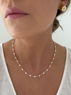 D E T A I L S - 18K Gold Filled, Freshwater Pearls Synthetic - 16" length with a 2" extender - Lobster Clasp  M A T E R I A L S At Dylan Rae, we are committed to handcrafting jewelry that is perfect for everyday wear. Our high-quality gold filled designs contain 100+ times more real gold than gold plated components. The thick outer layer of gold makes it highly durable and safe for people with allergies or sensitive skin. C A R E Care for Your Gold Filled Jewelry: Wear It, Love It, Care for It! Our gold-filled pieces are crafted to be your lifelong companions. Feel free to wear them every day, even while showering, but remember to avoid exposing them to saltwater and chlorine. These elements can diminish their luster over time and may even cause oxidation if they come in contact with your Affordable 8mm Bead Pearl Necklace, Dainty Single Strand Beaded Necklaces For Wedding, Dainty Single Strand Beaded Necklace For Wedding, Gold Single Strand Chain Necklace For Wedding, Delicate White Pearl Drop Chain Necklace, Dainty Single Strand White Chain Necklace, Dainty White Single Strand Chain Necklace, White Single Strand Necklace For Wedding, Delicate Single Strand Chain Necklace For Gift