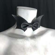 "captivating bow tie suitable for an unorthodox funeral. ~ bat made from faux vegan leather ~ ghoulish update on classic bowtie style ~ perfect for a gothic evening out ~ your choice: with or without fangs ~ choker band measures 1/2\"{1.27cm} wide ~ bat measures 6\" {15.24cm} wide x 3\" {7.62cm} high ~ adjustable to help find the perfect fit ~ closes in back with black metal hook ~ measure your neck circumference {9th pic} ~ choose your size from the drop down menu ~ if you are in-between measur Goth Choker Necklaces, Goth Choker, Vampire Fangs, Gothic Chokers, San Angelo, Black Goth, Halloween Vampire, Luna Moth, Black Bat