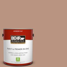 a can of behr paint on a gray background