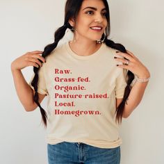 "We recommend sizing UP one or *two* sizes if you want an oversized look! ❗❗Estimated processing time for this t-shirt is 2-7 business days.❗❗ Shirt Details: This listing is for ONE (1) Soft Cream Tee with our signature \"RAW. GRASS-FED. ORGANIC. PASTURE-RAISED. LOCAL. HOMEGROWN.\" graphic. There may be a slight difference in the colors due to different monitors.   🌞100% combed and ring-spun cotton  🌞Fabric weight: 4.2 oz (142 g/m2) 🌞Shoulder-to-shoulder taping 🌞Pre-shrunk fabric 🌞Side-seamed Care Instructions: Separate by color. Wash in cold water. Tumble dry. Iron if necessary. I love creating products for you! When your order arrives, please send me a photo by posting a review. I would be so grateful and I cannot wait to see!" Organic Relaxed Fit Crew Neck Tops, Organic Cotton Short Sleeve Fall Top, Organic Cotton Short Sleeve Tops For Fall, Farmers Market Tshirt, Farm T Shirt, Dry Branch, Farmer Shirt, Food Shirt, Organic Food