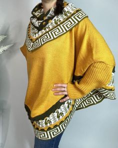 Mustard/Yellow Alpaca Blend Women's Luxury Poncho from The Andes Of Peru. Beautifully crafted poncho sweater, layered with Inca designs. Warm and perfect sweater to wear with jeans or pants, unique and stylish piece goes with just about everything. Comfortable wide cape -  Nice V-neck poncho sweater at the front and rounded at the back ideal for cold winter seasons. Size: One Size / They are all one size/standard Measurements:   L 70 cm / 28 inch - W 98 cm / 38 inch approximate CARE TIPS: - Machine wash on wool program at 30 o C, or just cold water by hand. - Use a detergent for wool. - Do Not Use Spin Cycle or dryers. Air dry. Each piece is uniquely made, it means that you will receive a truly unique product which is why slight difference since it is individually handmade. Colors may appe One-size Batwing Sleeve Sweater For Layering, One Size Batwing Sleeve Sweater For Layering, Yellow Turtleneck Top For Winter, Yellow Turtleneck Sweater For Fall, Soft Knit Yellow Top For Winter, Trendy Yellow Soft Knit Sweater, Trendy One Size Batwing Sleeve Sweater, Yellow Casual Sweater, Oversized Turtleneck Poncho For Winter