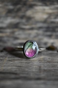 Oval cut silver ring with green at the top, clear in the middle and pink at the bottom. Rustic Engagement Ring, Rustic Engagement Rings, Watermelon Tourmaline Ring, Brown Jewelry, Great Fashion, Tourmaline Stone, Alternative Engagement Rings, Tourmaline Ring, Watermelon Tourmaline