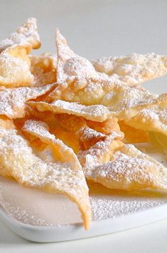 some powdered sugar covered food on a white plate