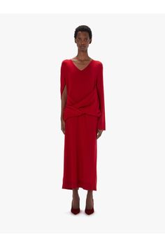 Find JW ANDERSON Front Drape Dress on Editorialist. Long-line asymmetric dress with drape front detaillingV-necklineRelaxed silhouetteAsymmetric sleeves and draped front panelRibbed hemline and cuffsCentre back slitRegular fit - take your usual sizeColour: Bright RedComposition - Main: 90% Wool, 10% CashmereMade in ChinaSKU: KW1219YN0264417 Dress With Drape, Asymmetrical Sleeves, Zip Front Dress, Drape Dress, Draped Midi Dresses, Organic Cotton Dress, Asymmetric Dress, Cherry Dress, Designer Drapes