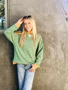 Taupe & green striped crewneck pullover sweater true to size, model is wearing a small Casual Long Sleeve Sweater With Striped Sleeves, Casual Sweater With Striped Sleeves For Fall, Casual Oversized Sweater With Striped Sleeves, Casual Striped Sleeves Sweater For Fall, Oversized Striped Sweatshirt For Fall, Fall Sweatshirt With Striped Sleeves, Striped Relaxed Fit Sweatshirt For Fall, Casual Cotton Sweater With Striped Sleeves, Trendy Crew Neck Sweater With Contrast Stripes