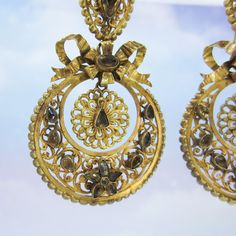 "These earrings are beyond exquisite, BEYOND. I encourage you to zoom way in on the pics and look at the absolutely incredible metal work on these beauties, it is phenomenal. Made circa 1850, very possibly earlier, these earrings are done in the pendeloque style popularized in the mid-1700's. Bezel set foil-backed citrines sit atop hand sawn scrolling metalwork that is full of fine detail. And as if things couldn't get any better, these are also day/night! And they're not just day/night with two Victorian Yellow Gold Earrings For Evening, Antique Earrings With 17 Jewels For Ceremonial Occasions, Formal Filigree Baroque Earrings, Formal Baroque Filigree Earrings, Victorian Style Ceremonial Earrings For Pierced Ears, Traditional Gold Baroque Earrings, Gold Baroque Victorian Earrings, Gold Victorian Baroque Earrings, Victorian Baroque Earrings