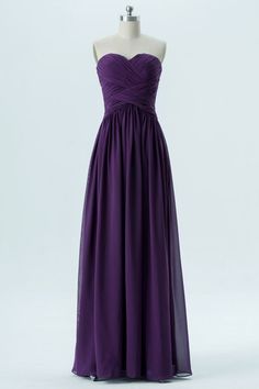 a strapless purple bridesmaid dress on a mannequin