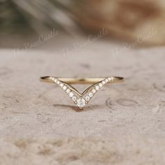 Unique Moissanite Wedding Band Yellow Gold Moissanite Curved Wedding Ring Art Deco Stacking Matching Chevron Ring Promise Rings For Women ITEM DETAILS ●Available in yellow, white or rose solid 10k, 14k or 18k gold. This ring can be made in Platinum. ❀❀Wedding band  Stone: Moissanite Shape: Round Shape Weight: about 0.106ct Band width around 1.3mm Visit my shop for more jewelry: https://www.etsy.com/shop/TheRoseCastle if you would like to customize your unique ring, you may contact us about your ideas and pictures. Hope I could get the chance to create fabulous rings for you! ❀Production ---- This ring is handmade and very good quality! Please allow 2-4 weeks for production. It can be made to any ring size.  ❀Engraving service We accept the engraving order, leave a note when placing an orde Yellow Gold Chevron Wedding Band, Marquise Rings, Chevron Wedding Band, Wedding Band Yellow Gold, Curved Wedding Ring, Wedding Ring Art, Wedding Rings Art, Chevron Wedding, Stacked Wedding Rings