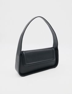 The Independence Bag features a chic structured medium-size rectangle design that seamlessly blends with practicality. Inside, an internal pocket keeps your essentials organized, while the magnetic closer ensures quick and secure access. The structured top handle is attached to both sides of the bag for a modern design. ETHICALLY HANDCRAFTED BY STIVALI MEASUREMENTS: Length: 11" Width: 2.5" Height: 6" FEATURES/MATERIALS: Smooth leather Interior zipper pocket Magnetic closure Embossed Logo Rectang Sleek Rectangular Shoulder Bag For Everyday Use, Versatile Top Handle Baguette Bag For Business, Modern Top Handle Baguette Bag, Sleek Bags With Removable Pouch, Sleek Rectangular Satchel With Detachable Strap, Modern Business Satchel Baguette Bag, Modern Business Baguette Satchel Bag, Minimalist Shoulder Bag With Magnetic Closure For Office, Modern Baguette Shoulder Bag For Business