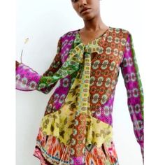 Beautiful Blouse Pull Over Tie Neck Green Pink Orange Yellow Vibrant Long Sleeve Multicolor Print Blouse, Vibrant Multicolor Print Long Sleeve Blouse, Summer Orange Patchwork Tops, Bohemian Orange Patchwork Tops, Vibrant Multicolor Long Sleeve Blouse, Vibrant V-neck Blouse In Multicolor Print, Orange Blouse With Vibrant Print For Spring, Orange Printed V-neck Blouse, Vibrant V-neck Blouse With Multicolor Print