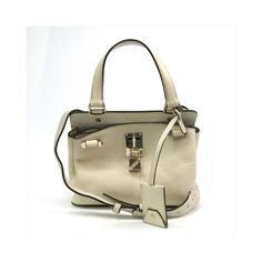 Br : Valentino Garavanimodel: Joylockcolor: Whitematerial: Pony-Style Calfskininclusions: Padlock (With Key) Shoulder Strapdimensions: Height : 17 Cm X Width : 22 Cm X Depth : 10 Cmserial Number: Bg-Pa55vsl2country Of Origin: Italycondition: Ab - Good Condition.If You Have A Preference For A Relaxed Contemporary Style This Joylock Bag From Valentino Garavani Is An Ideal Choice! Its Exquisite Design Attracts Fashion-Conscious Individuals Especially Women.The Item Displays Minor Signs Of Use With Beige Rectangular Bag With Lock, Rectangular Beige Bag With Lock, White Travel Bags With Lock, Designer White Satchel With Palladium Hardware, White Bags With Lock For Everyday, Leather Shopping Bags With Lock, Beige Bag With Lock For Daily Use, Chic Beige Bag With Lock, Elegant White Bag With Lock