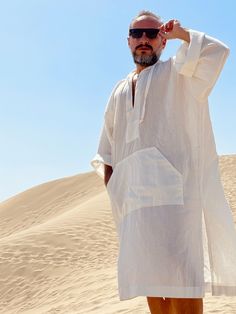 Hand made From start to finish Linen and cotton mixed lightweight fabric night gown for men Mens natural fabric caftan It's a special kind of linen which is only made in Anatolia ( i uploaded the fabric's detailed picture ) Lightweight White color Plus size avalible Small/medium/large/ xlarge / 2XL / 3XL / 4XL / 5XL size options Feel free to Ask for custom made Front pocket - kangaroo pocket Gift for him Super comfortable men's clothing to wear at home or outdoor Linen outfit Nightgown Pool part Casual White Long Sleeve Thobe, Casual White Long Sleeve Kaftan, Elegant Summer Tunic Thobe, Casual Summer Tunic Thobe, Casual Long Thobe For The Beach, Casual Long Thobe For Vacation, Casual Tunic Thobe For The Beach, White Long Thobe For Summer, Oversized Tunic Thobe For Beach