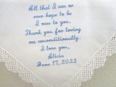 an embroidered handkerchief with the words, all that i am ever hope to be thank you for loving me unconditionally