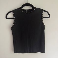 Vintage 90's Black Sleeveless Cropped Tank With Silver Round Studs Around The Neckline And Arm Holes. Looks Brand New, No Fading To Color, Lots Of Stretch, Super Cute Top. Made In The Usa. 90% Cotton/10% Lyrcra Pit To Pit: 14" Waist: 13" Sleeve Length: Length: 18.5" Size Label: Medium Best Fit: Small-Medium Depending On Desired Fit Brand: Styles Edgy Cropped Fitted Tank Top, Edgy Fitted Cropped Tank Top, Casual Cropped Tank Top For Night Out, Fitted 90s Tank Crop Top, 90s Style Sleeveless Stretch Crop Top, 90s Style Fitted Sleeveless Crop Top, Fitted Sleeveless 90s Crop Top, Edgy Cropped Tank Top For Spring, Y2k Tank Top For Night Out