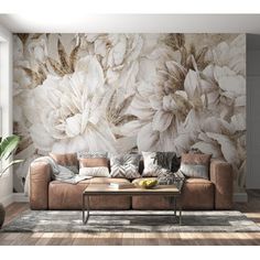 a living room scene with focus on the couch and wallpaper that looks like flowers