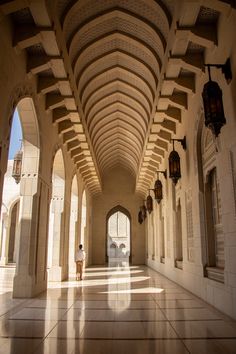 the inside of an ornate building with columns and arches