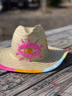 Brighten your spring or summer wardrobe with this hand-embroidered hat. It will add a pop of color to any outfit, and can be styled in so many different ways.Material: Palm.Sizes:Small * 54-55 cm (21-21 ½ inches).Medium *56-57 cm (21 ⅞- 22 ¼ inch... Handmade Beach Hat, Embroidered Cowboy Hat, Evil Eye Embroidery, Colorful Evil Eye, Eye Embroidery, Embroidery Hat, Negative Vibes, Eye Motif, Canvas Hat