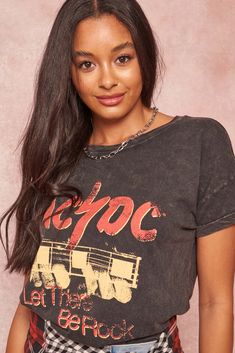 Mineral-washed graphic t-shirt Vintage-style AC/DC logo print with guitar graphic and "Let There Be Rock" text. Round neckline. Short drop-shoulder sleeves. Loose fit. 100% Cotton. Imported top designed and printed in LA. Officially licensed AC/DC merchandise. Not eligible for discounts. Model wears size S. Ac Dc Logo, Acdc Logo, Dc Logo, Guitar Graphic, Charcoal Color, Ac Dc, Shoulder Sleeve, Logo Print, Drop Shoulder