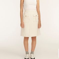 Brand New With Tags J. Crew Ecru Denim Skirt. Sits At Waist, Front Flap Pockets, Side Zip Closure. Length Measures ~20.5" 100% Cotton High Waist Beige Cotton Skirt, High-waist Beige Cotton Skirt, High Waist Beige Cotton Cargo Skirt, Trendy Beige Cargo Skirt For Spring, Beige Cargo Skirt For Spring Workwear, Fitted Beige Cargo Skirt, Casual Style, High Waist Beige Cargo Skirt For Spring, High-waist Beige Cargo Skirt For Spring, Casual White Denim Skirt