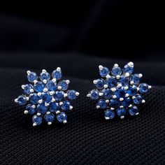 Product Details Make her feel special by presenting her our Flower Stud Earrings, adorned by a cluster of Round Shape Lab Created Blue Sapphires, meticulously secured with a prong setting to form a captivating floral design. These stud earrings come with screw-back findings, ensuring both comfort and security in wear. To suit your personal style, these stunning created sapphire earrings are available in a range of metal options. Product Information SKU SHP-EARRINGS042168934 Weight 1.50 gm (Appro Flower Earrings Studs, Sapphire Earrings, Flower Studs, Prong Setting, Blue Sapphire, Sapphire, Blue Color, Floral Design, Jewelry Design