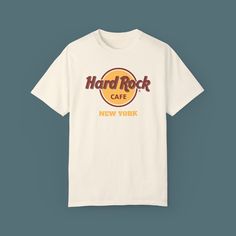 Personalized Hard Rock Cafe T-Shirt - Message or Date and Country Option Reflecting the rock spirit, the iconic Hard Rock Cafe t-shirts are now even more special! These classic shirts stand out with the Hard Rock Cafe logo on the front, and you can make them completely unique by adding your personal message or selecting your region, country, and more below the logo. Moreover, expressing your style and memories is now easier with a variety of color options available. FEATURES: Made from 100% high-quality cotton fabric. Suitable for daily wear with its comfortable and durable structure. Features the iconic Hard Rock Cafe logo on the front. Available in many color options (White, Black, Blue, Grey, and more). Customizable with your Special Message and country option (such as New York, London, White Music-themed Crew Neck T-shirt, Rock And Roll Cotton T-shirt With Short Sleeves, Rock And Roll Crew Neck T-shirt With Screen Print, Rock And Roll Screen Print Crew Neck T-shirt, Rock And Roll Cotton Graphic T-shirt, Cotton Rock And Roll Graphic T-shirt, Cotton Rock And Roll T-shirt With Graphic Print, Cotton Rock And Roll T-shirt With Short Sleeves, Rock And Roll Relaxed Fit T-shirt With Crew Neck