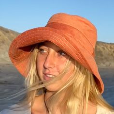 "A wide brim bucket hat for sun lovers and beach fun.  This rust corduroy hat for women has a nice wide brim to protect your whole face and even your neck and chest.  Easy to bring along in your bag, a packable sun hat. A great outdoor style accessory. This hat is made from a rust colored cotton corduroy fabric.  Inside liner is white cotton.  I used interfacing inside the brim to keep it's shape. Brim measures 4.5\" Crown depth is 3.5\". Contact me for custom fit option. SIZES AVAILABLE S - mea Casual Adjustable Orange Sun Hat, Casual Orange Adjustable Sun Hat, Adjustable Orange Cotton Bucket Hat, Adjustable Wide Brim Orange Sun Hat, Orange Adjustable Wide Brim Sun Hat, Orange Cotton Bucket Hat For Summer, Adjustable Orange Wide Brim Sun Hat, Orange Cotton Beach Hat, Orange Cotton Summer Hat