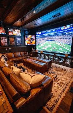 a living room filled with furniture and a large screen tv mounted to the wall above it