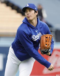 a baseball player wearing a catchers mitt on the field