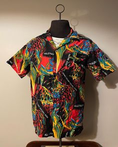 Vintage Hawaiian Shirt  - 100% cotton  - All over print design - Volcano graphic  - Abstract style art  - 70s/80s vintage  Size: L  Great vintage condition  No rips or holes  No stains Multicolor Cotton Hawaiian Shirt With All Over Print, Multicolor Cotton Shirt With Graphic Print, Multicolor Relaxed Fit Shirt With Graffiti Print, Casual Camp Shirt With Vintage Print In Relaxed Fit, Casual Camp Shirt With Vintage Print And Relaxed Fit, Retro Printed Hawaiian Shirt, Spring Patterned Hawaiian Shirt With Graphic Print, Spring Hawaiian Shirt With Graphic Print, Groovy Graphic Print Summer Shirt