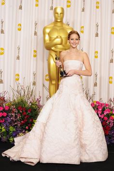 the actress poses with her award for best performance in a leading role at the oscars