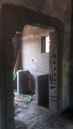 the inside of an unfinished room that is being remodeled with concrete and cement blocks in place