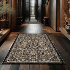 a large rug is on the floor in a hallway