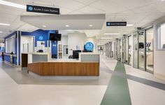 an empty hospital lobby with blue and white walls