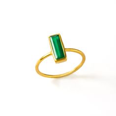 "Breaking new ground with this Adira Series dainty gemstone bar rings. This modern bar ring features carefully faceted rectangular Green Onyx. Perfect for weddings, bridal parties, everyday, date night, and birthdays! Gemstone is approximately 10 x 3 mm (0.3 x 0.1 inches). This ring is available in different US SIZES ✦ Size 6 ✦ Size 7 ✦ Size 8 ✦ Size 9 Metal ✦ 18K Yellow Gold Plated over Sterling Silver ✦ 18K Rose Gold Plated over Sterling Silver ✦ Sterling Silver THIS RING IS AVAILABLE IN A VAR Modern Jewelry With Rectangular May Birthstone, Modern Rectangular May Birthstone Jewelry, Modern Stackable Emerald Ring For A Gift, Modern Stackable Emerald Ring As A Gift, Modern Stackable Emerald Ring As Gift, Modern Stackable Emerald Ring Gift, Rectangular Gemstone Ring For Everyday, Minimalist May Birthstone Jewelry In Rectangular Shape, Gift Emerald Ring With Rectangular Stone