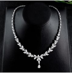 Sparkling Cubic Zirconia Jewelry Set for Brides: Necklace, Earrings, and Bracelet - WonderlandByLilian Elegant Cubic Zirconia Jewelry Set In Diamond White, Elegant Diamond White Jewelry Set With Cubic Zirconia, Fine Jewelry Cubic Zirconia Bridal Necklace For Party, Hand Set Cubic Zirconia Bridal Necklace For Party, Elegant Sterling Silver Rhinestone Necklace For Wedding, Exquisite Bridal Necklace With Sparkling Cubic Zirconia, Exquisite Cubic Zirconia Diamond Necklace For Party, Party Necklaces With Hand Set Cubic Zirconia, Silver Cubic Zirconia Bridal Necklace For Evening