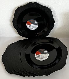 three black plates stacked on top of each other