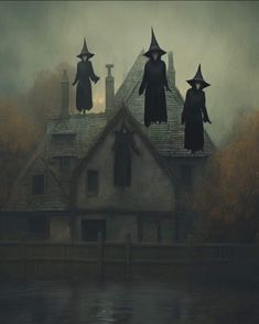 three witches on top of a house in the foggy water with trees behind them