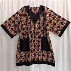 Lovely Africa inspired; African print fabric, black, red, yellow and white print dashiki trimmed in black with matching kufi (sold separately). Garment is 100% cotton. Excellent workmanship maybe worn as work causal, semi formal and formal as desired. All year round. Dashiki comes in size XL and 3X Large. KUFI $30.00 ordered to head size. Items sold separately. Black Printed V-neck Kaftan, Traditional Black Printed Kaftan, Black Printed Tunic Kaftan, Black Printed Short Sleeve Kaftan, Black Printed Kaftan With Short Sleeves, Traditional Multicolor Ankara Fabric Kaftan, Traditional Multicolor Ankara Kaftan, Traditional Black Cotton Agbada, Black Cotton Short Sleeve Kaftan