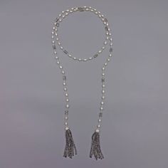 "- A trend-right lariat necklace with tassels that are hand wired with cultured pearls and crystals, unique designed necklace with extensive workmanship. Free shipping/domestic USA. - Total Length: 50\"L. Necklace length: 47\".Tassel Length: 3\"L. - Beads:Cultured fresh water pearls; rice shape: 6-7mm, potato shape: 8-9mm. Crystal beads; Faceted 4x6mm in black diamond and white opalite. - Style:Cultured pearl wire wrapping lariat choker tassel necklace. - Premier quality wire that does not tarni Luxury Formal Necklace With Latkans, L Necklace, Pearl Chain Necklace, Y Necklace, Water Pearls, Pearl Chain, Lariat Necklace, Necklace Length, Cultured Pearls