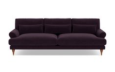 a purple couch sitting on top of a white floor