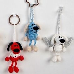 three crocheted key chains with dogs hanging from them