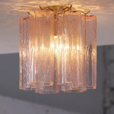 a chandelier hanging from the ceiling in a room