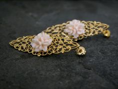 Boho Earrings, Edwardian Earrings, Gold Filigree Earrings, Boho Wedding, Edwardian Jewelry, Rose Earrings, Wedding Jewelry, Valentines Gift This lovely pair of earrings is sure to stand out. The pink rose flowers are set on 22 kart gold  Plated brass Romantic lace edge post. Bohemian chic gold earrings are a gorgeous piece with a real vintage feel to it! These earrings are made of gold plated element with a light pink resin flower. Great romantic jewelry for brides and bridesmaids. The earrings Traditional Flower Earrings For Wedding, Flower Shaped Clip-on Wedding Jewelry, Ornate Clip-on Wedding Jewelry, Ornate Clip-on Jewelry For Wedding, Filigree Plug Earrings For Weddings, Wedding Flower Dangle Earrings Pierced, Handmade Rose Gold Bridal Earrings For Wedding, Wedding Filigree Drop Flower Earrings, Elegant Handmade Wedding Plug Earrings