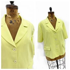 Cute vintage Pennington's lime green short sleeve blazer with a waffle texture. It's polyester with 4% elastane an the front in unlined while the front is lined. I picture this with cute wide leg jeans and sneakers or maybe a white platform slide for a fresh casual summer look. Size: 3XL (tag says 28... I'm not totally sure, please check measurements!) Bust: 59'' Waist: 58'' Length: 27 1/2'' Shoulder to shoulder: 20 1/2'' Condition: Very good. Summer Blazer With Single Button, Fitted Single Button Summer Outerwear, Fitted V-neck Summer Blazer, Solid Color Short Sleeve Summer Outerwear, Spring Tailored Short Sleeve Blazer, Tailored Short Sleeve Spring Blazer, Spring Short Sleeve Tailored Blazer, Short Sleeve Tailored Blazer For Spring, Spring Short Sleeve Blazer With Pockets