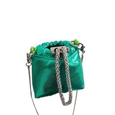 This metallic green mini crossbody purse is the statement piece you need to add to your collection. The drawstring closure and quilted finish give it an elegant look, while the solid pattern and art theme make it a unique addition to any outfit. The exterior of the bag is made with faux leather and metal, with silver hardware accents and a silver handle/strap material made of brass. Elegant Clutch, Mini Crossbody Purse, Art Theme, Solid Pattern, Mini Crossbody, Purse Bag, Crossbody Purse, Clutch Purse, Silver Hardware