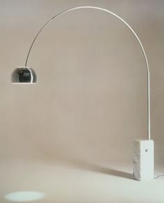 a white floor lamp with a marble base